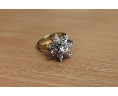 An 18ct gold diamond set ring, the principal stone weighing an estimated 0.3 carat, 7.4g