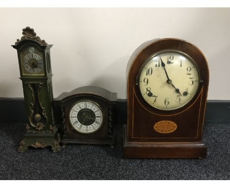 An Edwardian inlaid mahogany mantel clock, an oak mantel clock and a miniature longcase clock