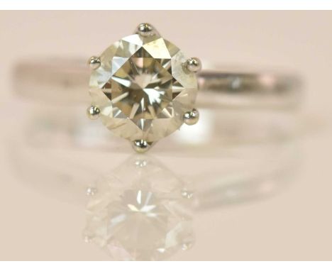 An 18ct white gold diamond solitaire ring, the round brilliant cut stone weighing approx 1ct in six claw setting, size K, app