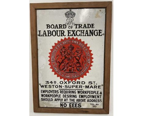 An Enamel Board of Trade Labour Exchange sign, 46 x 31 cm, mounted within a wooden frame.