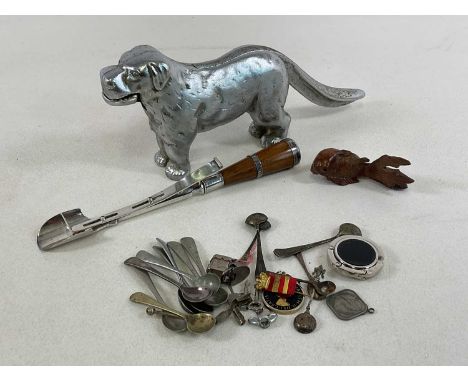 A large silvered nut cracker in the form of a dog, length 30cm, a silver plated and oak Stilton scoop and a small group of va