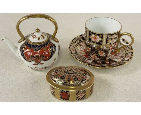 ROYAL CROWN DERBY; an Imari 2451 cup and saucer, a Royal Crown Derby Imari miniature kettle and a boxed Royal Crown Derby Old