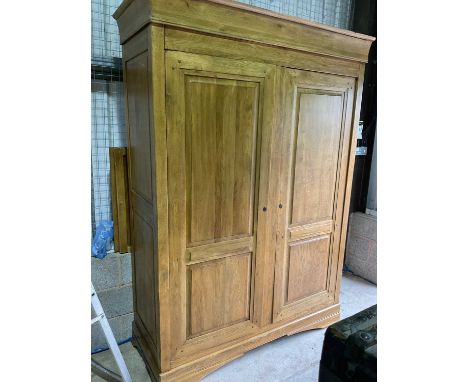 A modern light oak large wardrobe with panelled doors, height 218cm, width 153cm, depth 58cm.