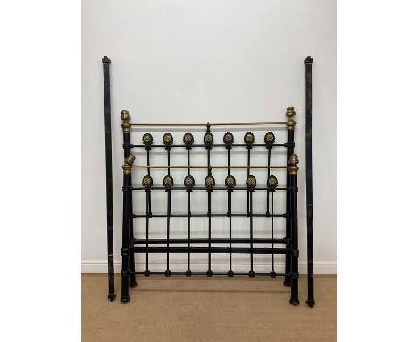 A brass and iron double bedstead, height 147cm, width 135cm, length 190cm.