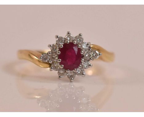 An 18ct yellow gold diamond and ruby floral cluster ring, size T 1/2, approx 5.3g.