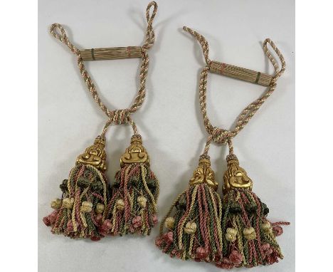 A pair of Watts of Westminster rope and gilded curtain tie backs.