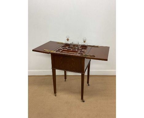 A reproduction Edwardian style rise and fall drinks cabinet with brass castors and hinges, height 78cm, diameter 55cm.