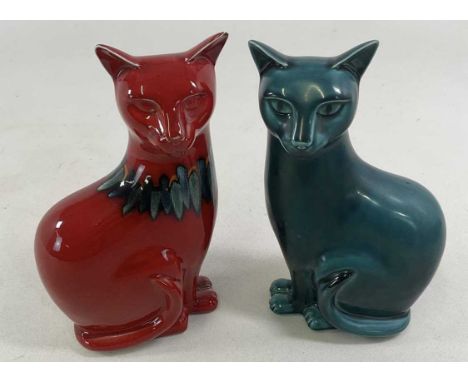 POOLE POTTERY; a pair of green and red glazed cats, height 29 cm, both marked to base.