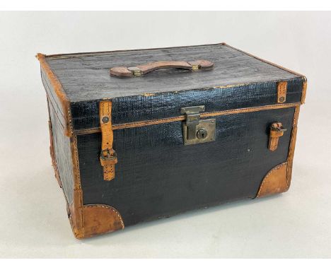 A 19th century painted canvas and leather trunk, height 34cm, width 57cm, depth 41cm.