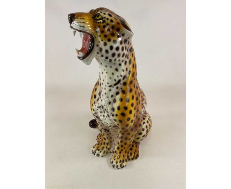 A large ceramic Cheetah figure, height 79cm, base 44cm.Condition Report: No visible cracks chips ,grazing or restoration.