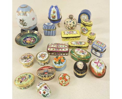 A group of porcelain trinket boxes including a Halcyon Days enamelled box and cover decorated with floral sprays, a large por