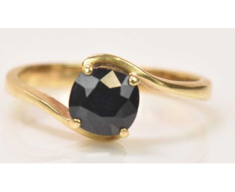 A 9ct yellow gold dark sapphire single stone ring, size K, approx 2.4g.