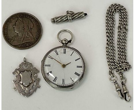 A Victorian silver key wind open faced pocket watch with Roman numerals to the enamel dial, a silver Albert chain, a shield s