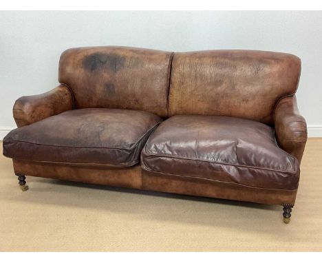 GEORGE SMITH; a brown leather sofa raised on turned front legs, length 180cm