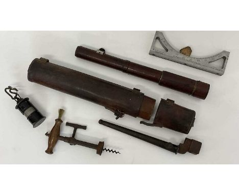 A leather clad brass bodied telescope 'Davon No. 2', an early corkscrew, a 1941 military issue target sight, a spike bayonet 