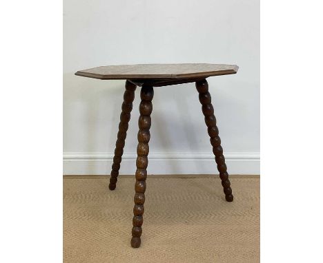 A 19th century oak cricket table with octagonal top and turned bobbin legs, height 60cm, width 61cm.