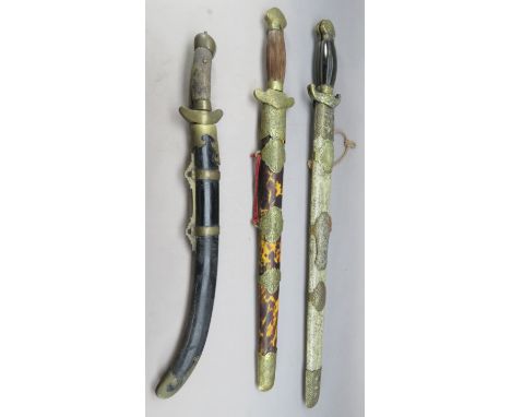 ˜A PAIR OF CHINESE HORN AND BRASS-MOUNTED SWORDS^ QING DYNASTY^ 19TH CENTURY; A SIMILAR SWORD AND A FURTHER PAIR OF SWORDS^ Q