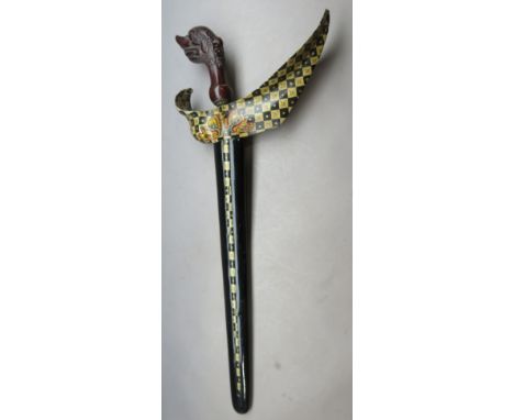 A SOUTHEAST ASIAN SHORTSWORD (KRIS)^ 20TH CENTURY¦with pattern-welded doubled-edged blade^ carved hardwood grip^ in its paint
