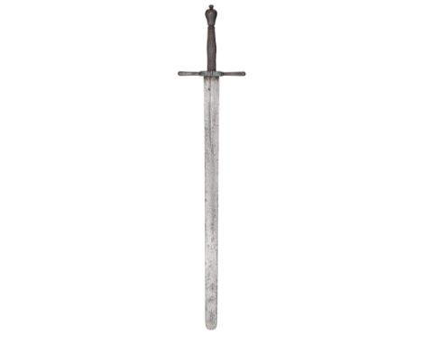 A GERMAN EXECUTIONER~S SWORD^ LATE 17TH CENTURY ¦with broad flat double-edged blade of characteristic form^ rounded at the ti