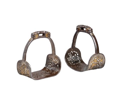 Ⓦ A PAIR OF DECORATED TIBETAN STIRRUPS^ 17TH/18TH CENTURY¦each with broad tread^ the outer surface damascened in silver^ pier