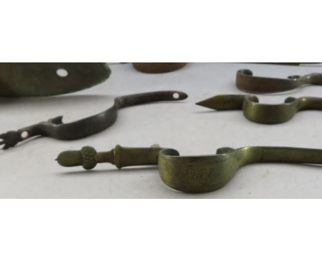 Ⓦ&nbsp;FIVE DETACHED TRIGGER-GUARDS AND A BUTT-PLATE^ CIRCA 1780-1830¦the first brass^ with acorn finial and a rococo flower 