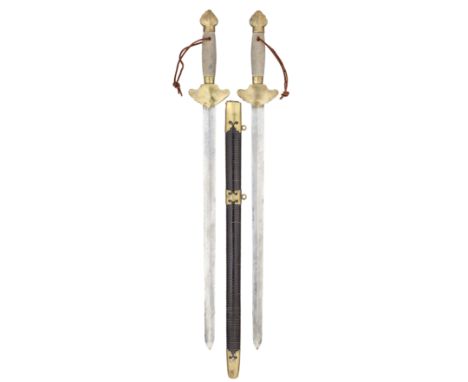 A PAIR OF CHINESE BRASS-MOUNTED SWORDS^ QING DYNASTY^ 19TH CENTURY ¦each with broad double-edged blade tapering sharply at th