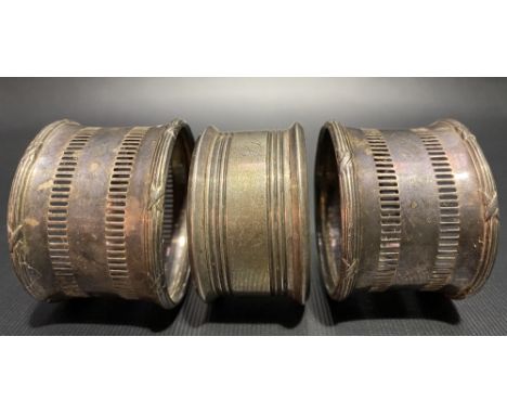 Pair of silver pierced napkin rings; together with one other napkin ring (3), weight 1.95oz approx.