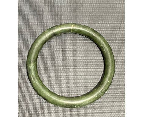 A spinach green jade bangle, diameter 8cm, weight 50g approx.