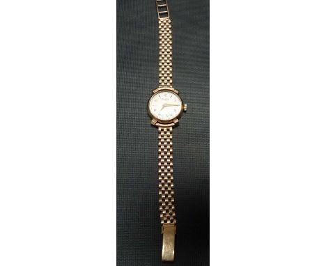 9ct gold ladies manual wind wristwatch by Helvietia, the silvered dial with gilt Arabic Numerals and baton markers and with s