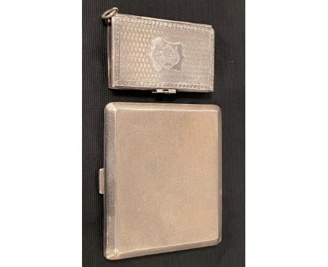 George VI silver engine turned cigarette case, London 1939; together with a white metal engine turned notebook cover, weight 