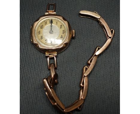 Early 20th Century 9ct gold ladies manual wind wristwatch, the 20mm silvered textured dial with Arabic Numerals, the movement