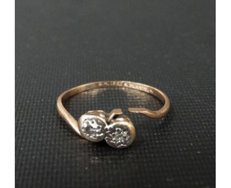 18ct gold and platinum diamond two stone crossover ring, the small diamonds in illusion setting, weight 1.6g approx.