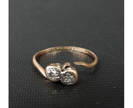 18ct gold and platinum diamond two stone crossover ring, the small diamonds in illusion setting, weight 1.6g approx.