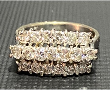 Modern 18ct white gold diamond set nineteen stone ring, the diamonds set in three lines, the diamonds of 0.05ct spread each a