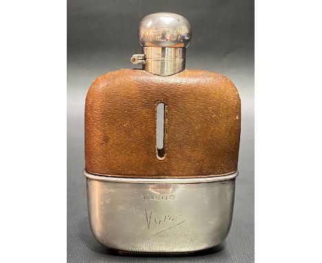 George V silver leather clad hip flask with silver drinking cup to the base, height 13.5cm, Birmingham 1925. (glass bottle wi