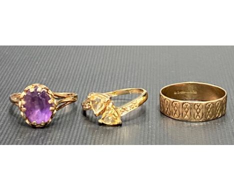 Three 9ct gold rings, one a band ring, the other set an amethyst, the other with two citrines, weight 5.6g approx.