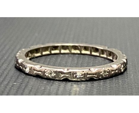 White metal, possibly platinum, diamond chip band ring, one stone missing, 2.7g approx.