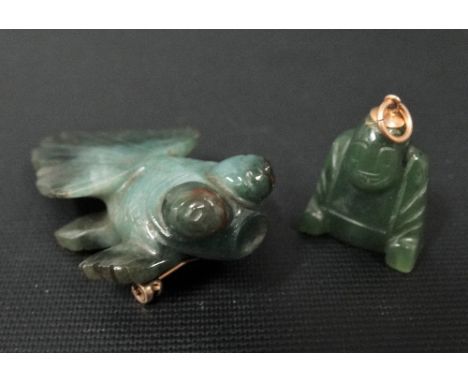 9ct gold and spinach green jade goldfish brooch together with a yellow metal mounted Buddha pendant (2)