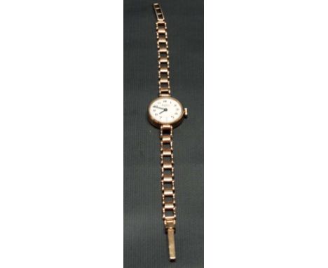 A 9ct hallmarked gold ladies manual wind bracelet wristwatch, the 16mm white dial with gilt Arabic Numerals signed 'Bentima S