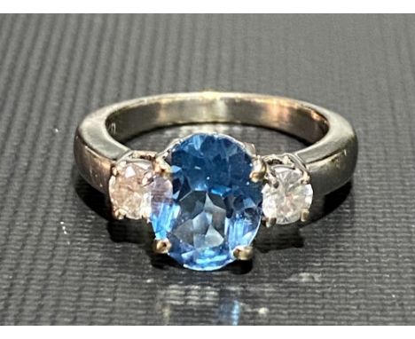 Modern 18ct white gold aquamarine and diamond set three stone ring, the aquamarine of 1ct spread approx, the diamonds of 0.10