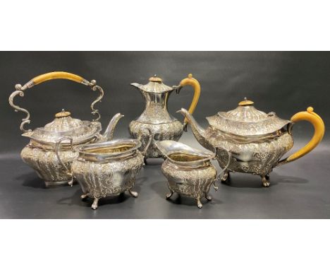 Good Victorian five piece silver tea set by Mappin Brothers, of ovoid lobed section and with foliate scroll embossed decorati