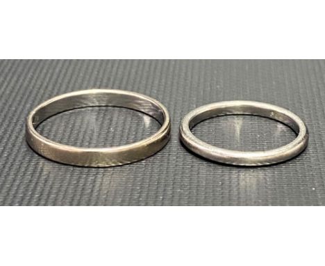 Platinum band ring, weight 2.8g approx; together with a white metal band ring stamped Bonda, weight of both 5.4g approx.