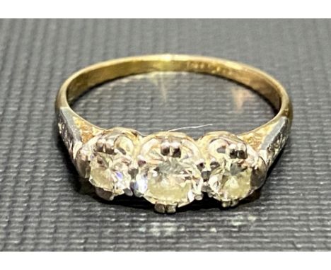 18ct gold and platinum diamond set three stone ring, the centre diamond of 0.25ct spread approx, the smaller diamonds of 0.15