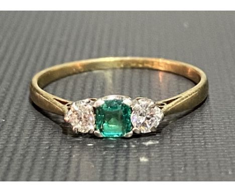 18ct gold diamond and emerald three stone ring, the diamonds each measuring 0.07ct spread approx, weight 1.5g approx.