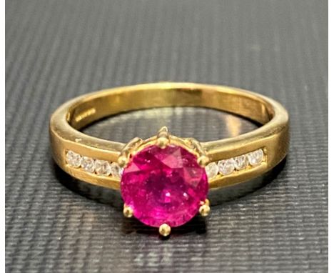 Modern 18ct gold ruby and diamond set ring, the ruby of 1ct spread approx, the shank with eight small diamonds, weight 3.9g a