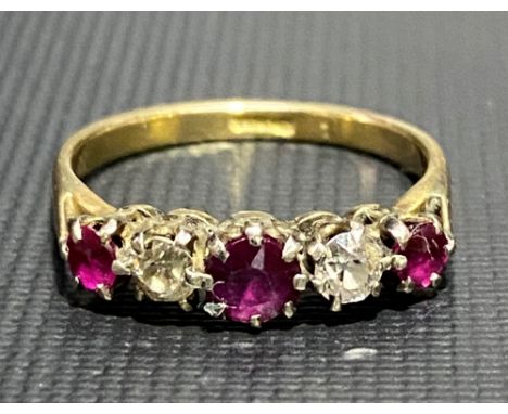 An 18ct gold diamond and ruby five stone ring, each of the diamonds of 0.10ct spread approx, weight 2.6g approx.