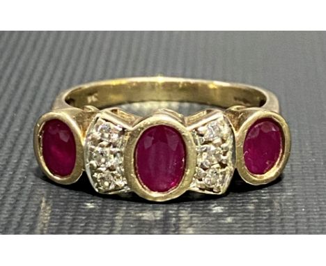 9ct gold diamond and ruby nine stone ring, the oval rubies of 0.20ct spread approx. separated by six small diamonds, weight 4