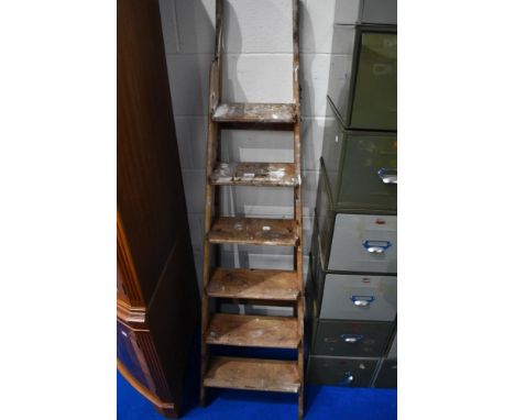 A set of vintage wooden step ladders