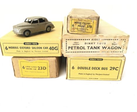 A collection of Dinky Toys Trade Boxes and a Morris Oxford Saloon Car.