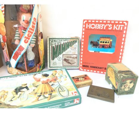 A Box Containing A Boxed Spanish cyclist. 2 X Vintage Jigsaws. Light Wicks etc.